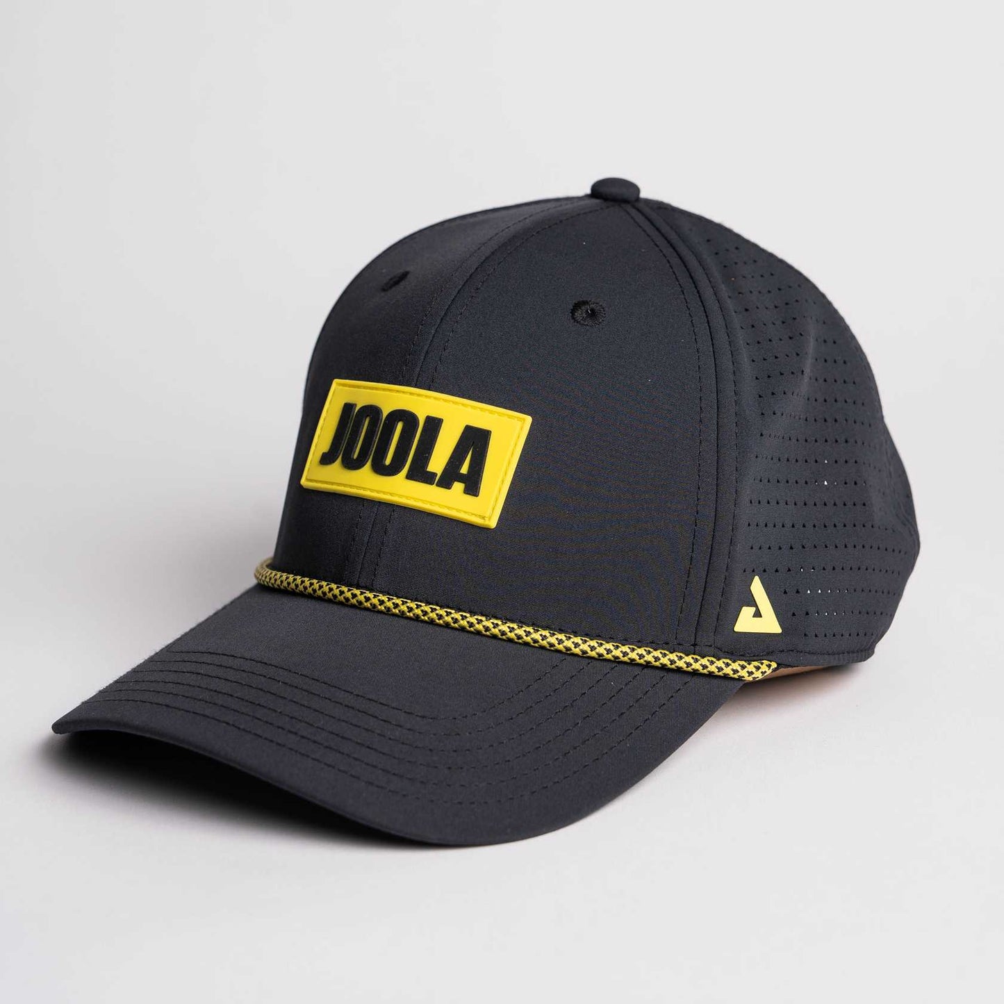 White background photo, product image of the JOOLA Rpe Cap, black with yellow branding.