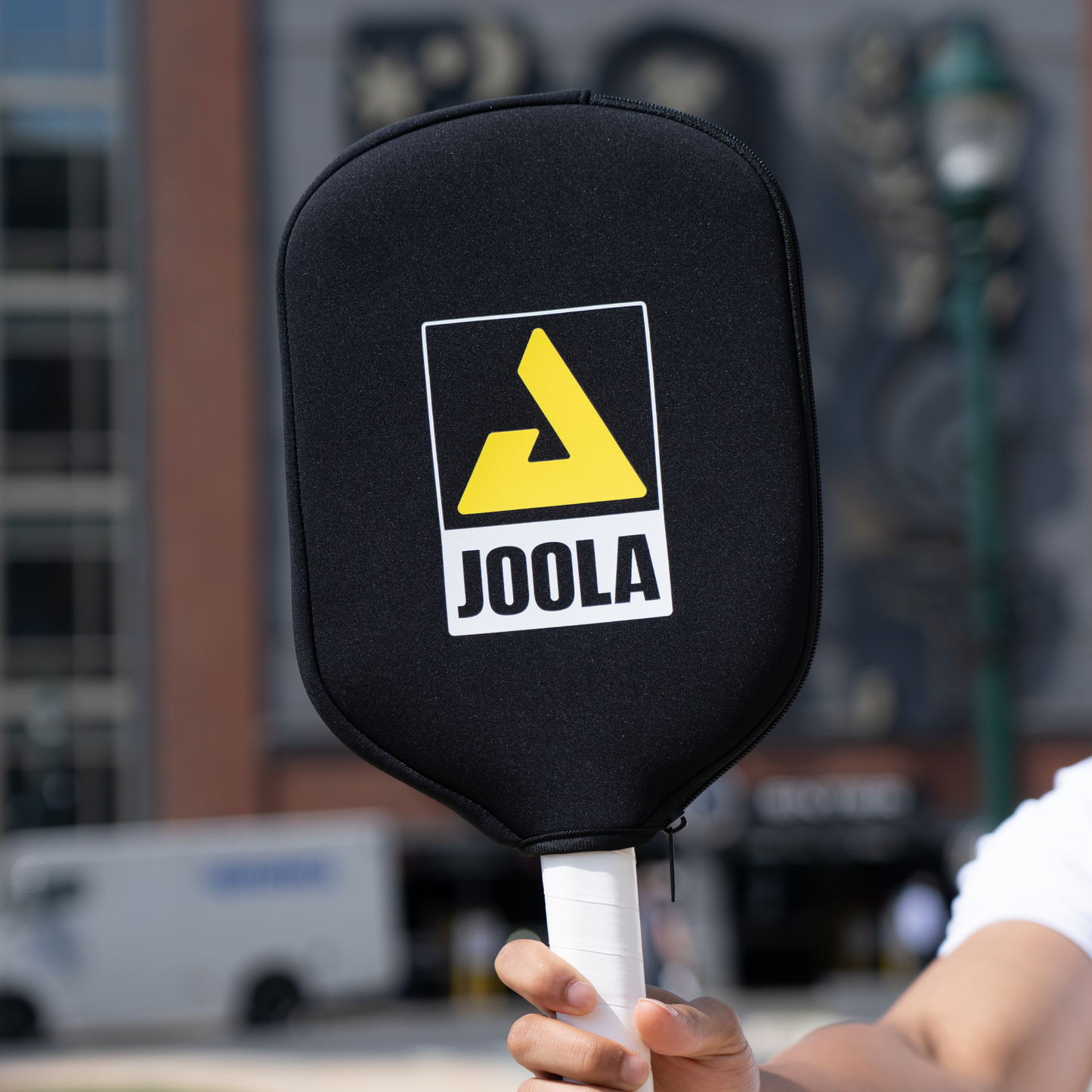 Joola Universal Neoprene Paddle Cover protecting a table tennis blade in hero shot display