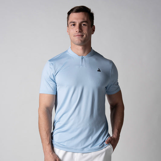 Gray background, image of a male model wearing a JOOLA Men's Court Polo, Blue Breeze.