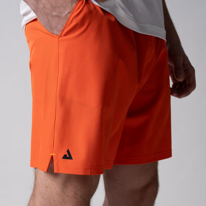 Gray background, close up image of the JOOLA Men's Woven Shorts, 7-inch, poppy red color.