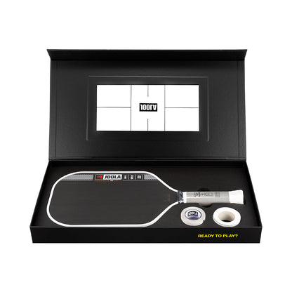 Pickleball paddle and ball set in a black box with a visible brand logo.