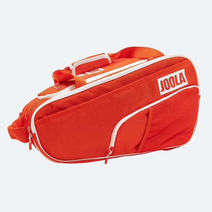Red sports bag with white accents and 'JOOLA' branding on a white background