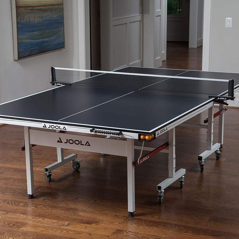 Image showing the JOOLA Rapid Play indoor table tennis table set up inside.