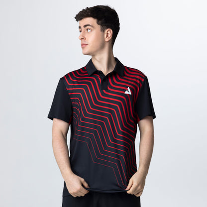 Person wearing a black and red patterned polo shirt on a light gray background