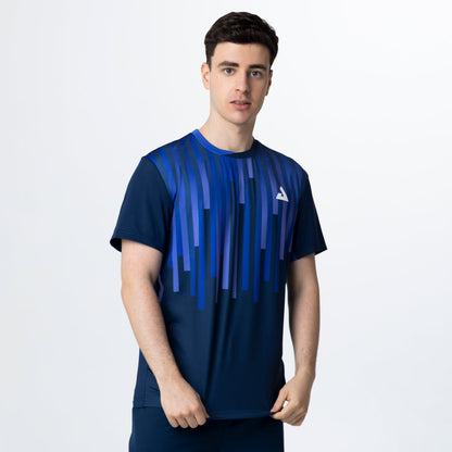 Man wearing a blue athletic shirt with a brand logo on a white background