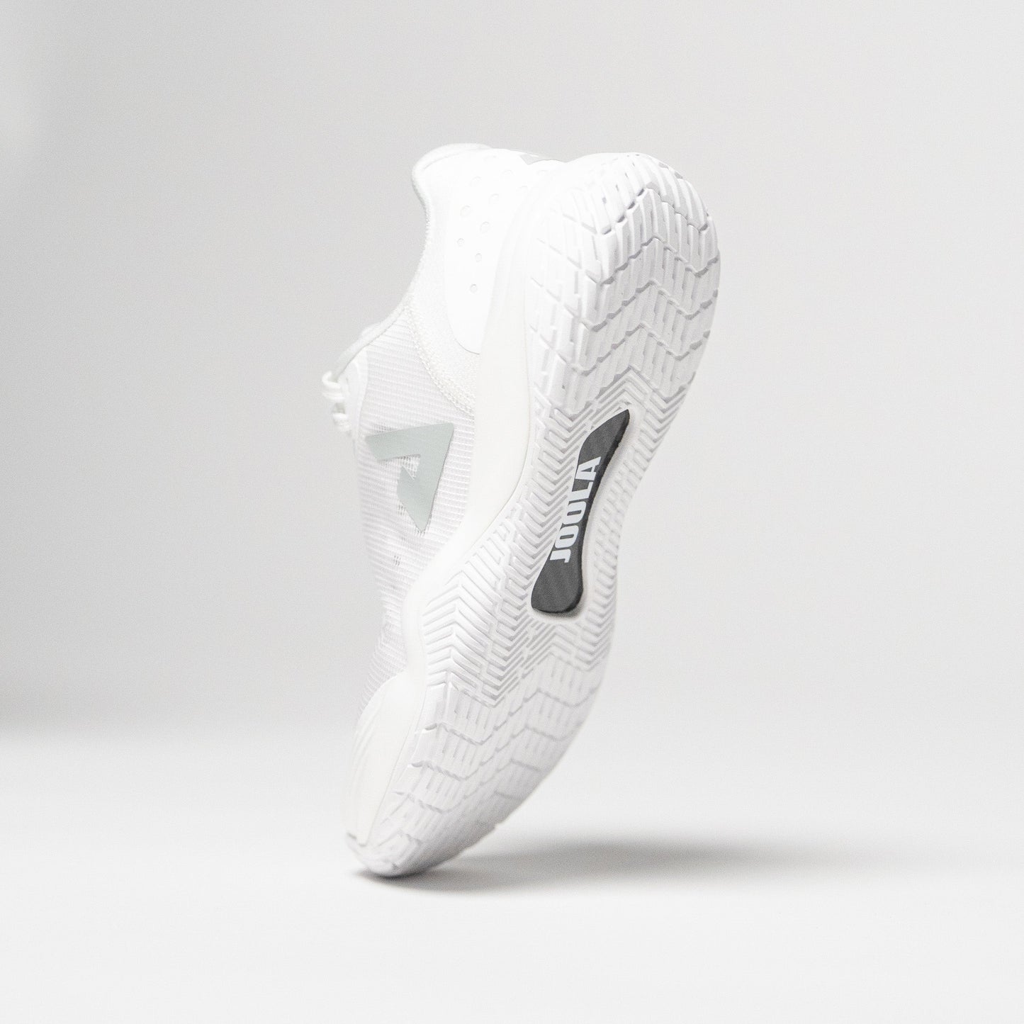 Image showing a single JOOLA R4LLy pickleball shoe, white colorway, with JOOLA Carbon Fiber shank pictured.