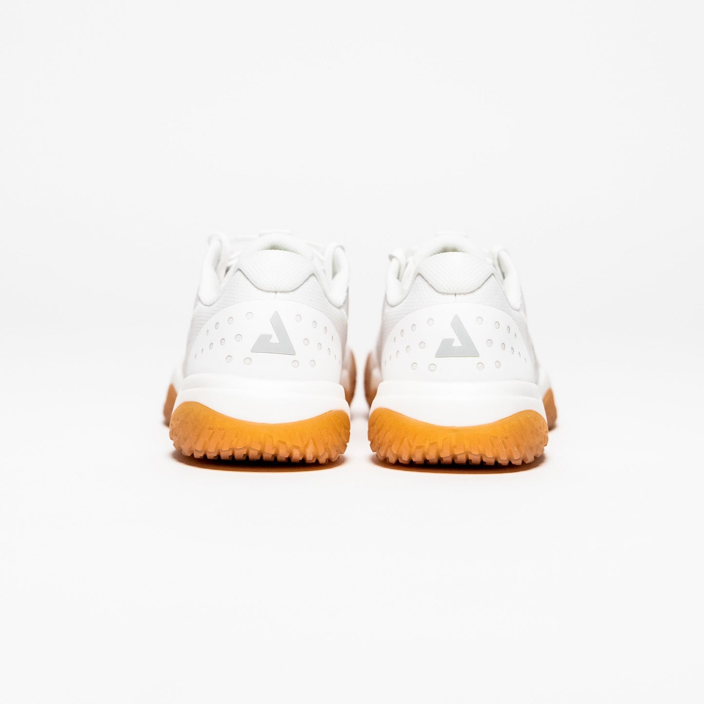 White background, image showing the the back of a pair of JOOLA Men's R4LLy pickleball shoes, white with gum soles.