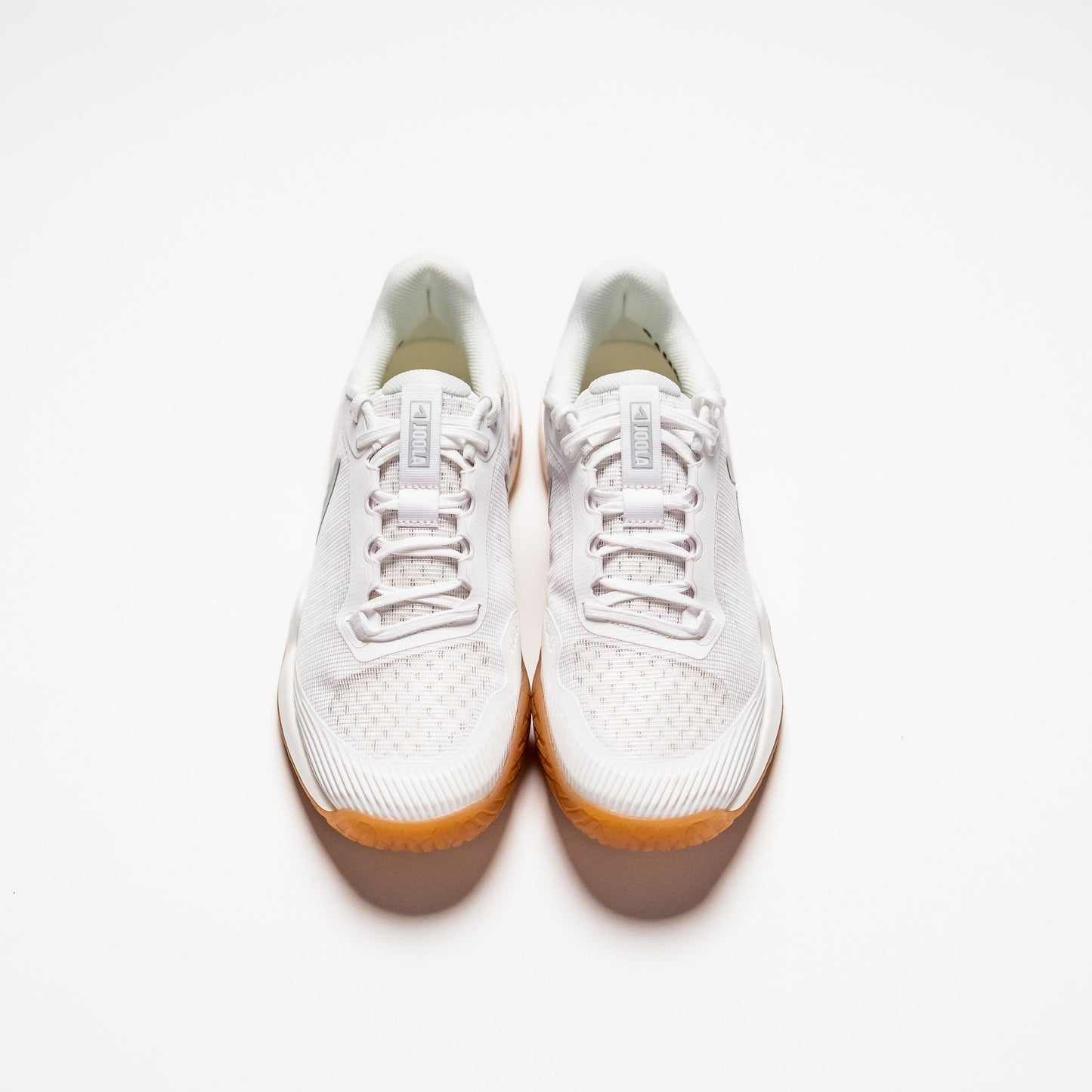 White background, top view of a pair of JOOLA Men's R4LLy pickleball shoes, white with gum sole.