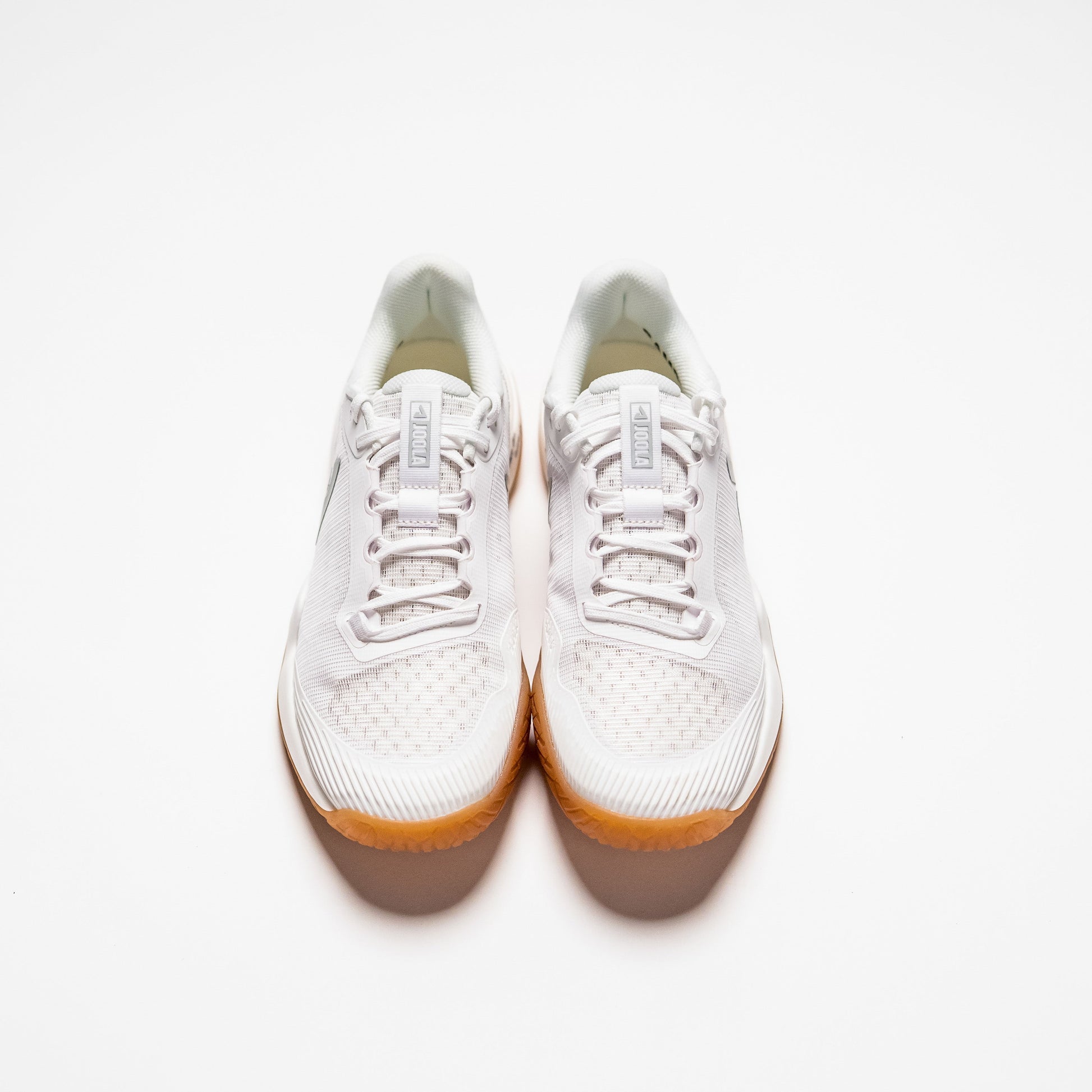 White background, top view of a pair of JOOLA Men's R4LLy pickleball shoes, white with gum sole.