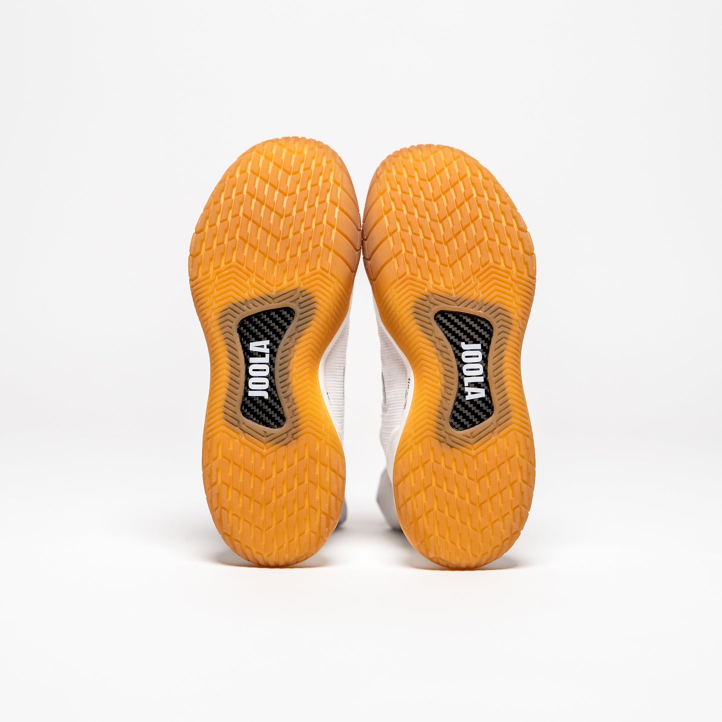 White background, product image showing the bottom of a pair of Men's R4LLy pickleball shoes, gum sole.