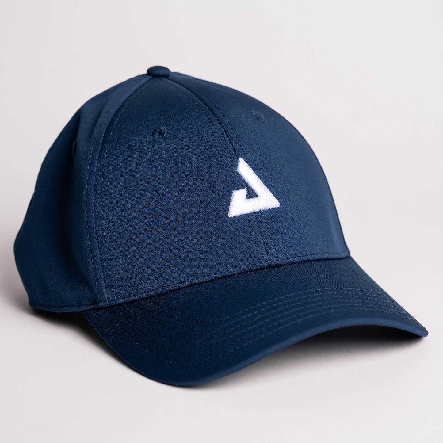 White background, product image of a JOOLA Essential Cap, Navy with white logo.