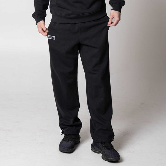 Gray background, image of a pair of JOOLA Fleece Pants, black.