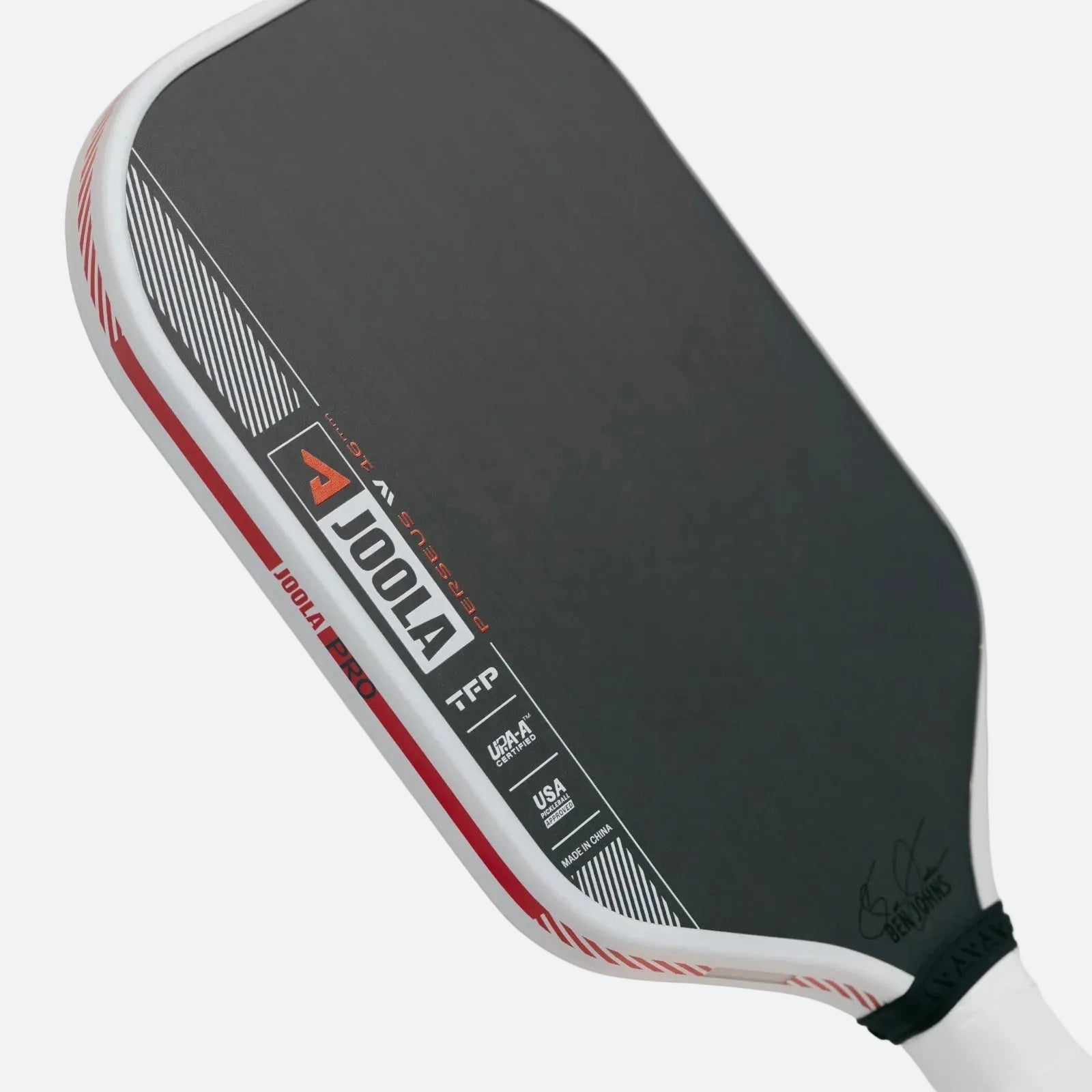 White background image, product image of the JOOLA Ben Johns Perseus Pro IV Pickleball paddle. White handle, black surface, white edge guard. 16mm.