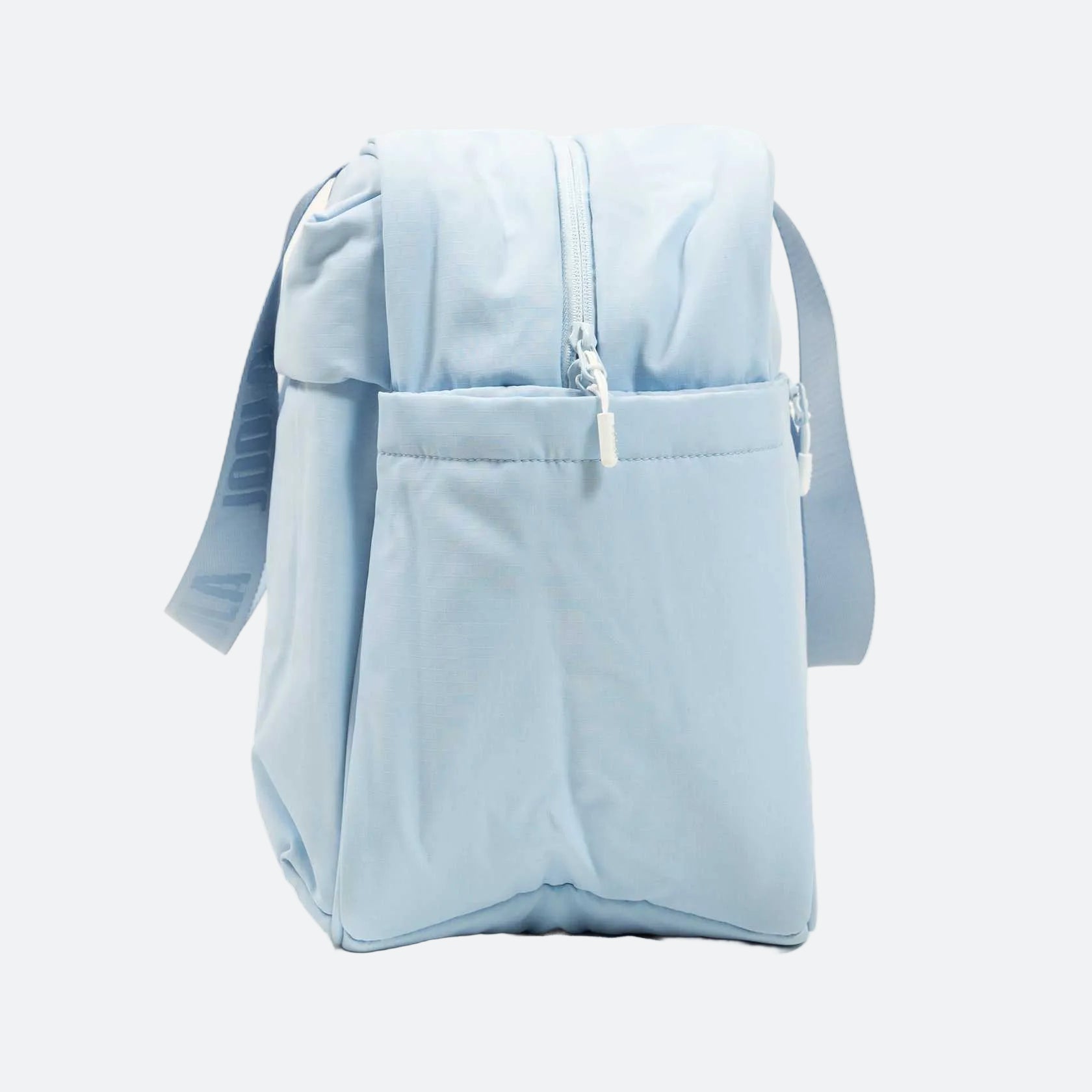 Light blue backpack with a front pocket on a white background