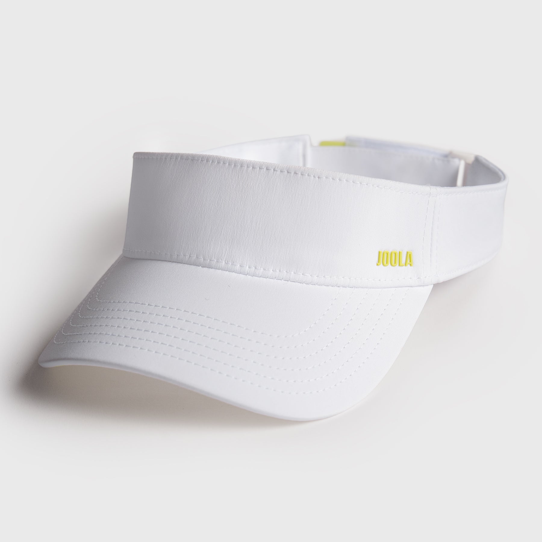 White visor with a JOOLA brand logo on a light gray background