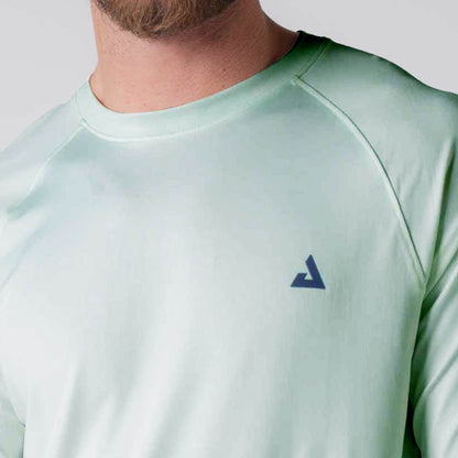 Close up image of the JOOLA logo over the left chest on a JOOLA Men's Court Long Sleeve, Hushed Mint.