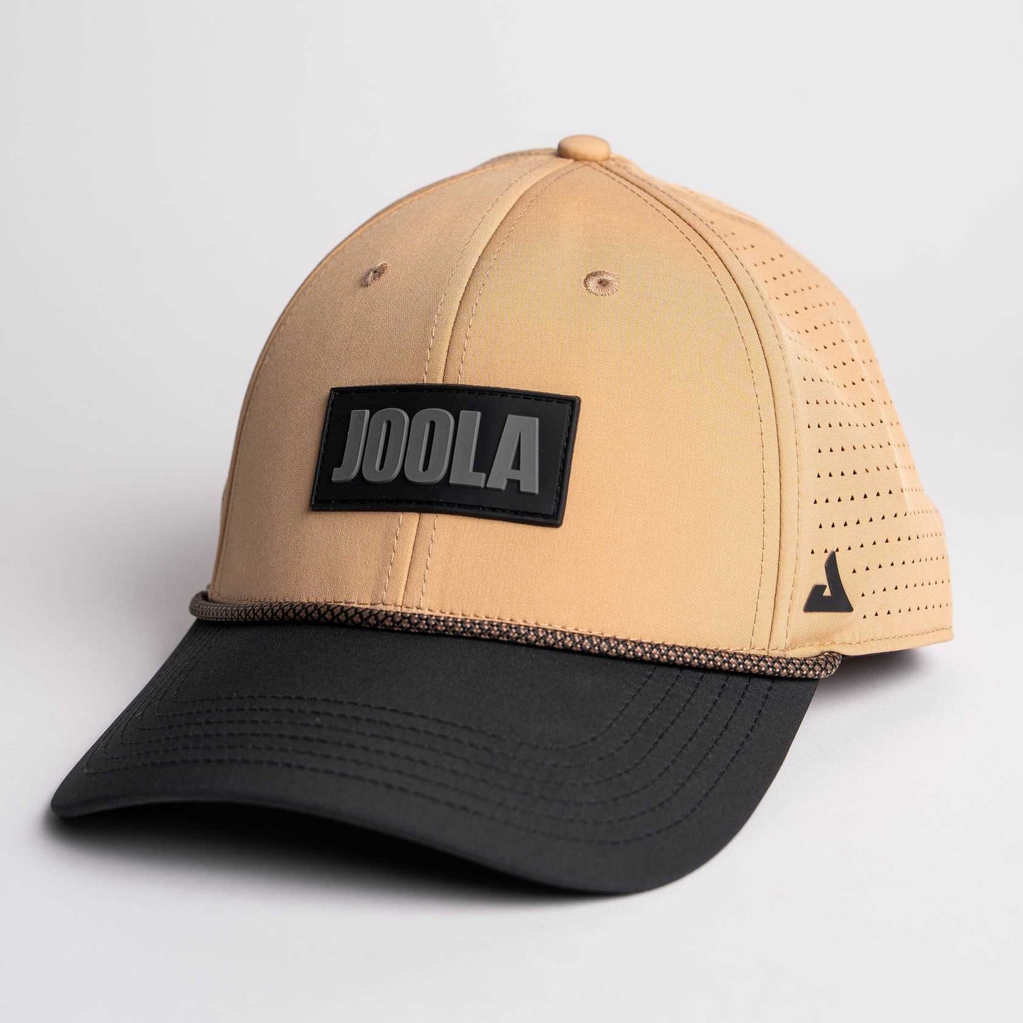 White background, product image of the JOOLA Rope Cap, latte colored with black bill and JOOLA Branding.
