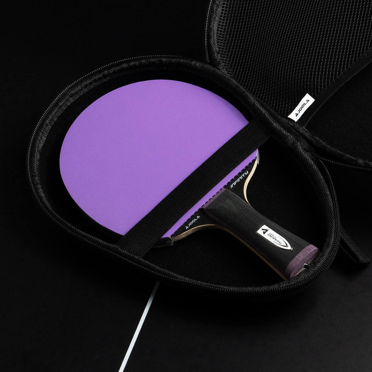 JOOLA Table Tennis paddle sitting in a JOOLA TT carrying case.