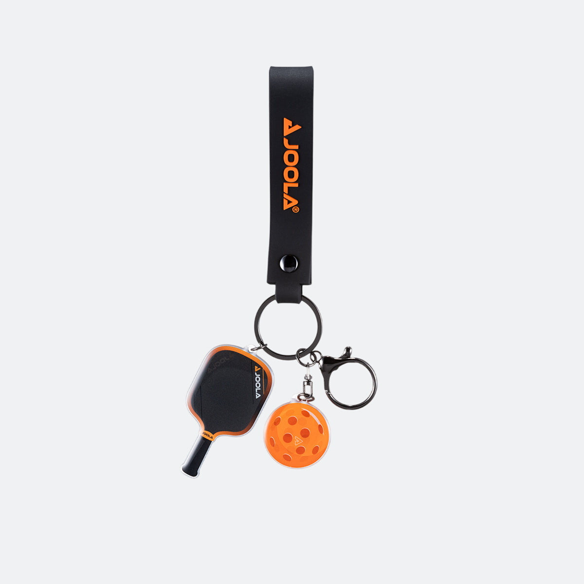 White background, product image of the JOOLA Collin Johns 3S paddle and ball keychain. Orange.
